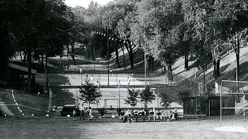 Black and white photo of the Quaker Oats Company park and tennis courts.