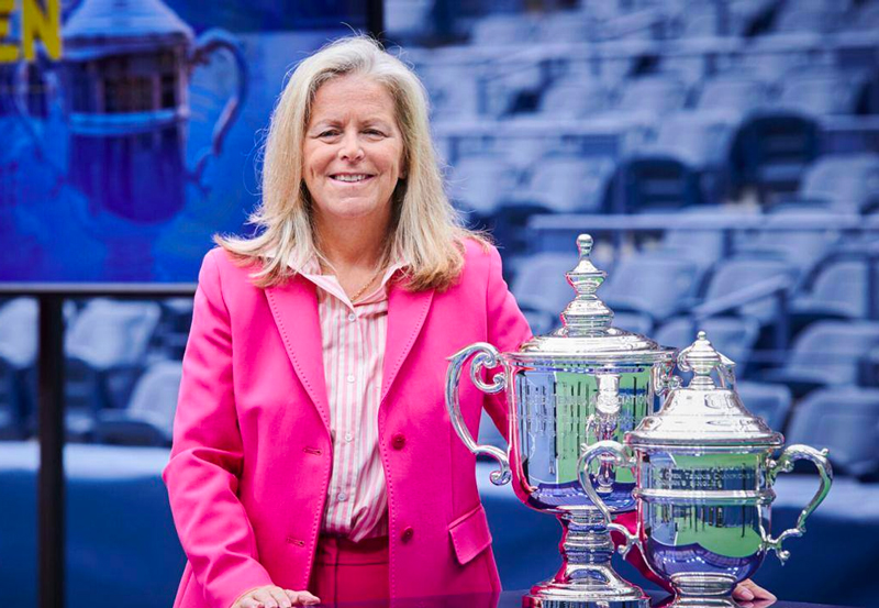 Stacey Allaster next to the US Open tennis trophies.